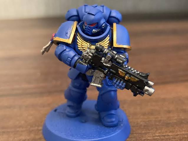 Blue Space Marine holding a weapon